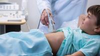 Young boy undergoes ultrasound exam.